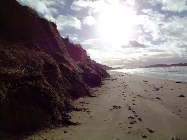 Sand-slides slumped all along the foot of the sand-cliffs at Traeth Penrhos Beach